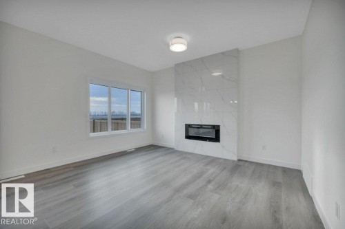 5259 47 Avenue, Calmar, AB - Indoor Photo Showing Other Room With Fireplace