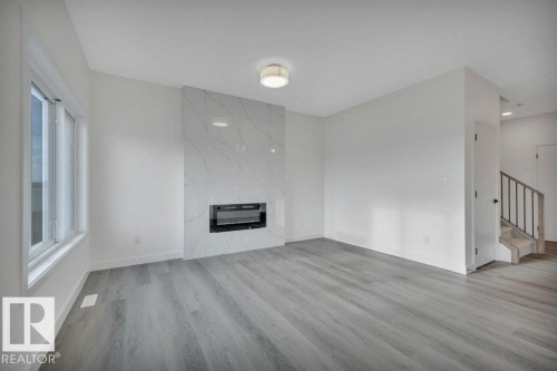 5259 47 Avenue, Calmar, AB - Indoor Photo Showing Living Room With Fireplace