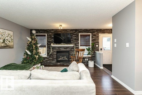 1017 Watt Promenade, Edmonton, AB - Indoor Photo Showing Living Room With Fireplace