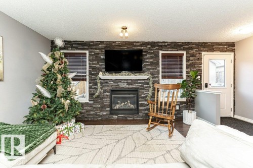 1017 Watt Promenade, Edmonton, AB - Indoor Photo Showing Living Room With Fireplace