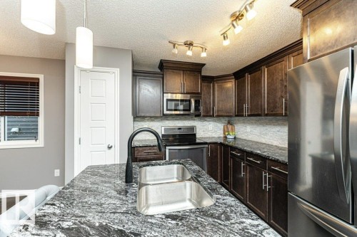 1017 Watt Promenade, Edmonton, AB - Indoor Photo Showing Kitchen With Stainless Steel Kitchen With Double Sink With Upgraded Kitchen