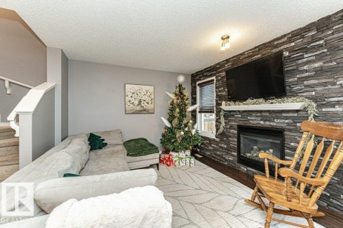 1017 Watt Promenade, Edmonton, AB - Indoor Photo Showing Living Room With Fireplace