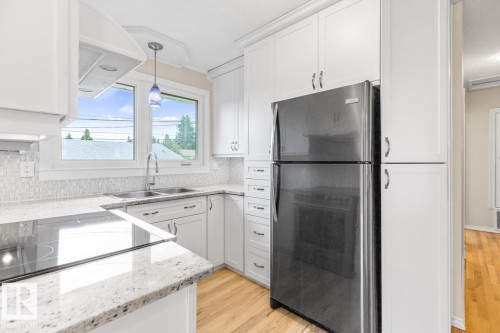 13908 57 Street, Edmonton, AB - Indoor Photo Showing Kitchen With Double Sink