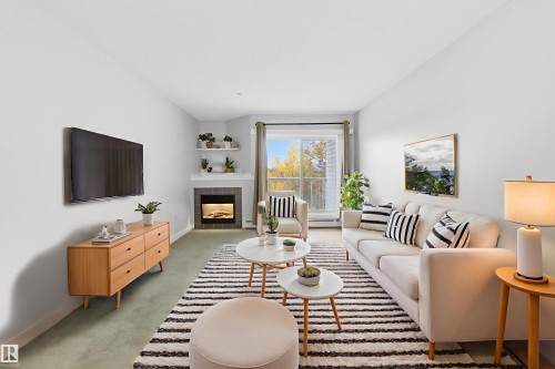 304 11446 40 Avenue, Edmonton, AB - Indoor Photo Showing Living Room With Fireplace