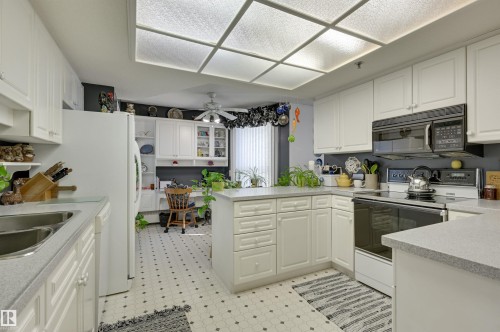 1401 12319 Jasper Avenue, Edmonton, AB - Indoor Photo Showing Kitchen With Double Sink