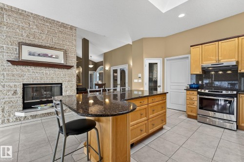 8835 159A Avenue, Edmonton, AB - Indoor Photo Showing Kitchen With Fireplace