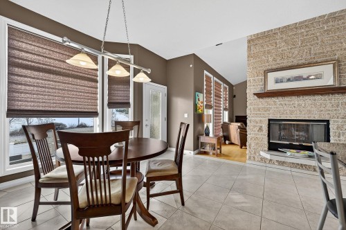 8835 159A Avenue, Edmonton, AB - Indoor Photo Showing Dining Room With Fireplace