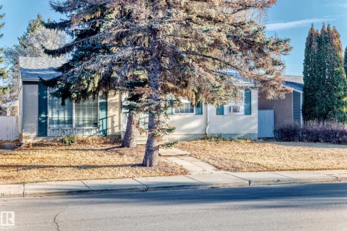 View of front of property with roof with shingles and stucco siding - Edmonton, AB - Outdoor