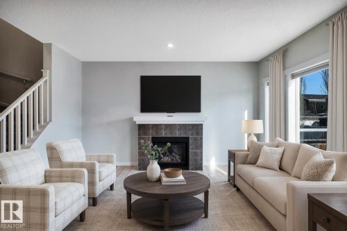 237 Sheppard Circle, Leduc, AB - Indoor Photo Showing Living Room With Fireplace