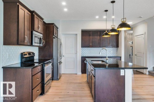 237 Sheppard Circle, Leduc, AB - Indoor Photo Showing Kitchen With Upgraded Kitchen