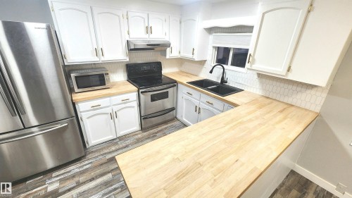 90 Rim Road Nw, Edmonton, AB - Indoor Photo Showing Kitchen With Stainless Steel Kitchen With Double Sink