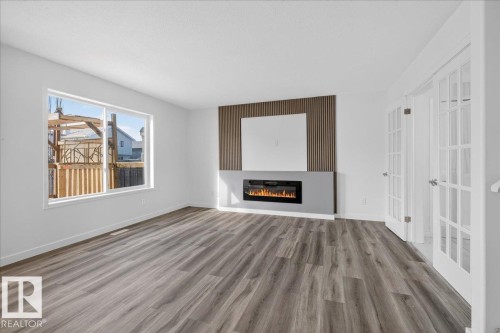 3323 26 Avenue, Edmonton, AB - Indoor Photo Showing Other Room With Fireplace