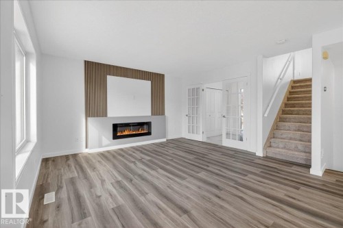 3323 26 Avenue, Edmonton, AB - Indoor Photo Showing Other Room With Fireplace