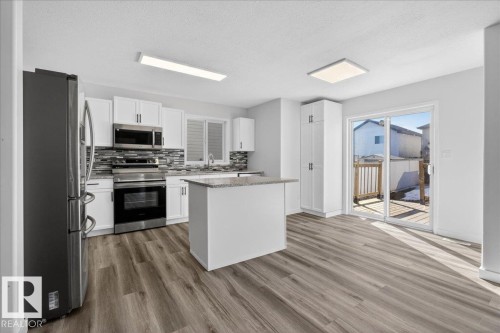 3323 26 Avenue, Edmonton, AB - Indoor Photo Showing Kitchen With Upgraded Kitchen