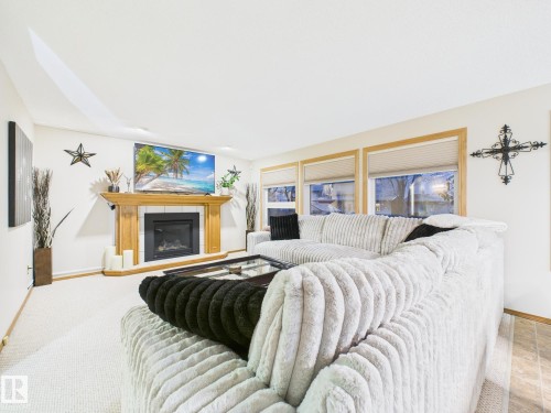92 Dufferin Street, St. Albert, AB - Indoor Photo Showing Bedroom With Fireplace