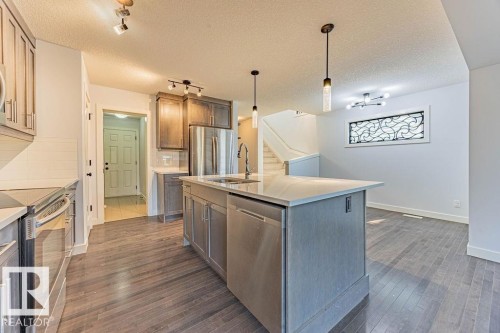 114 Radcliffe Wynd, Fort Saskatchewan, AB - Indoor Photo Showing Kitchen With Stainless Steel Kitchen With Upgraded Kitchen