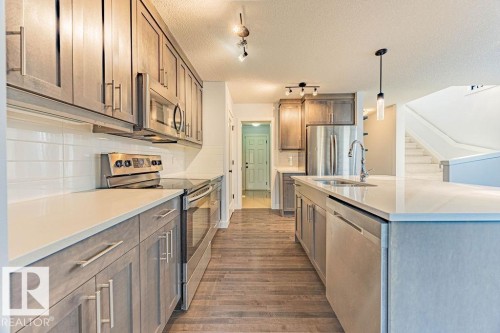 114 Radcliffe Wynd, Fort Saskatchewan, AB - Indoor Photo Showing Kitchen With Stainless Steel Kitchen With Double Sink With Upgraded Kitchen