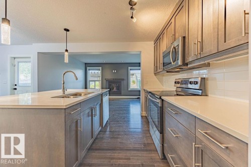 114 Radcliffe Wynd, Fort Saskatchewan, AB - Indoor Photo Showing Kitchen With Stainless Steel Kitchen With Double Sink With Upgraded Kitchen