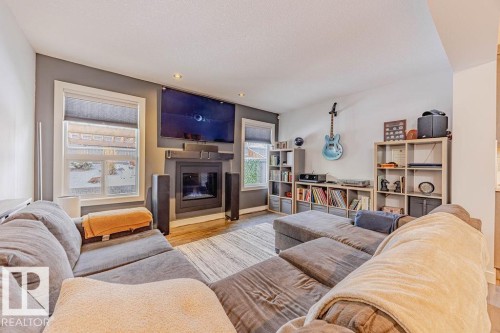 114 Radcliffe Wynd, Fort Saskatchewan, AB - Indoor Photo Showing Living Room With Fireplace