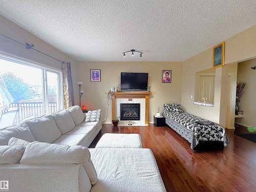 3756 13 Street, Edmonton, AB - Indoor Photo Showing Living Room With Fireplace