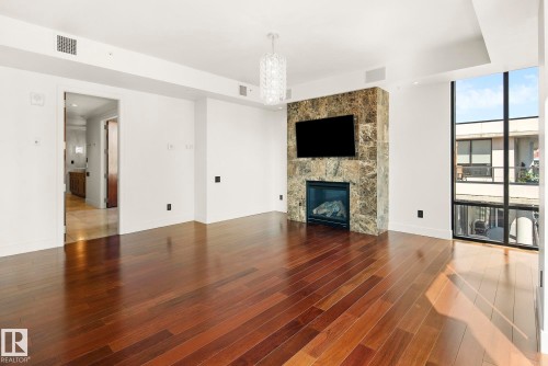 1200 11933 Jasper Avenue, Edmonton, AB - Indoor Photo Showing Living Room With Fireplace