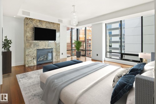 1200 11933 Jasper Avenue, Edmonton, AB - Indoor Photo Showing Bedroom With Fireplace