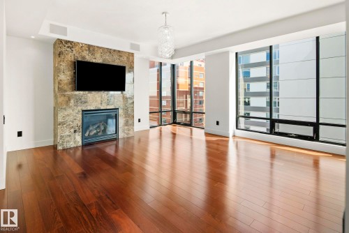 1200 11933 Jasper Avenue, Edmonton, AB - Indoor Photo Showing Other Room With Fireplace