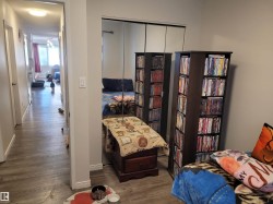 Sitting room featuring wood finished floors and baseboards - 
