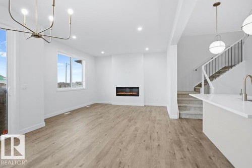 4847 Cawsey Terrace, Edmonton, AB - Indoor Photo Showing Other Room With Fireplace