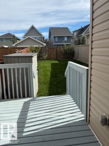 Wooden terrace featuring a fenced backyard and a residential view - 2433 Glenridding Boulevard, Edmonton, AB - Outdoor With Exterior