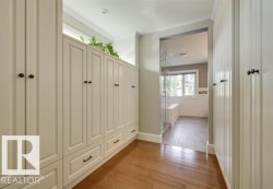 Mudroom with light wood finished floors and ornamental molding - 
