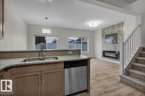 1515 21 Street, Edmonton, AB - Indoor Photo Showing Kitchen With Fireplace With Double Sink