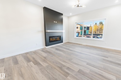 72 Patriot Way, Spruce Grove, AB - Indoor Photo Showing Living Room With Fireplace