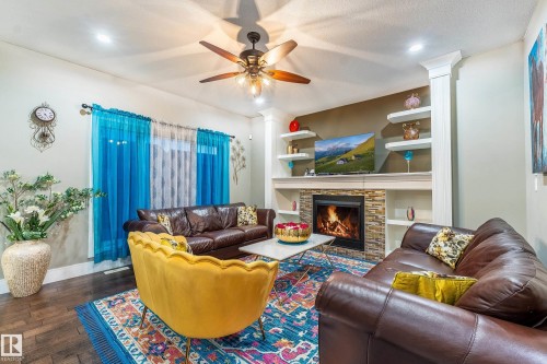 3235 16 Avenue, Edmonton, AB - Indoor Photo Showing Living Room With Fireplace