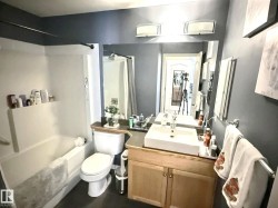 Bathroom featuring vanity and shower / bath combo with shower curtain - 