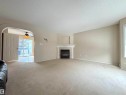124 1670 Jamha Road, Edmonton, AB  - Indoor Photo Showing Living Room With Fireplace 