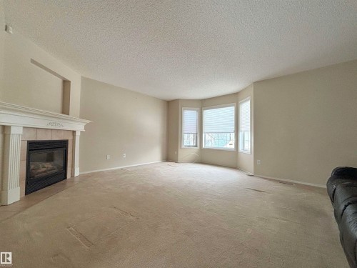 124 1670 Jamha Road, Edmonton, AB - Indoor Photo Showing Living Room With Fireplace