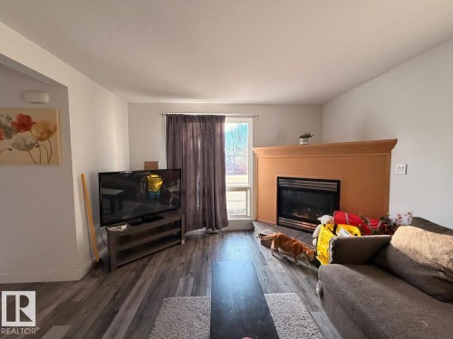 14597 121 Street, Edmonton, AB - Indoor Photo Showing Living Room With Fireplace