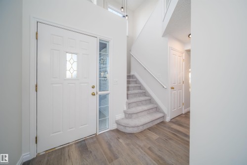 Entrance foyer featuring stairs, wood finished floors, and a towering ceiling - 3504 20 Street, Edmonton, AB - Indoor Photo Showing Other Room