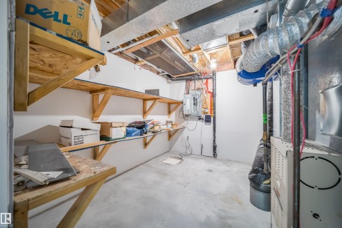 Unfinished below grade area featuring heating unit and electric panel - 3504 20 Street, Edmonton, AB - Indoor Photo Showing Basement