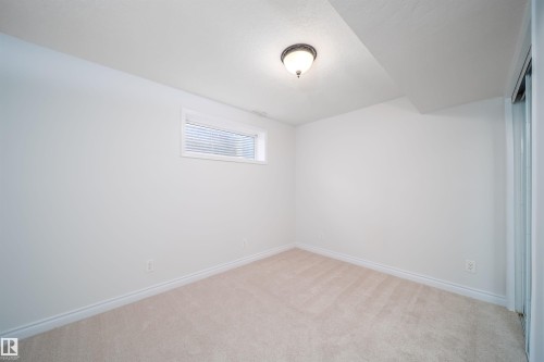 Unfurnished room with light colored carpet and baseboards - 3504 20 Street, Edmonton, AB - Indoor Photo Showing Other Room