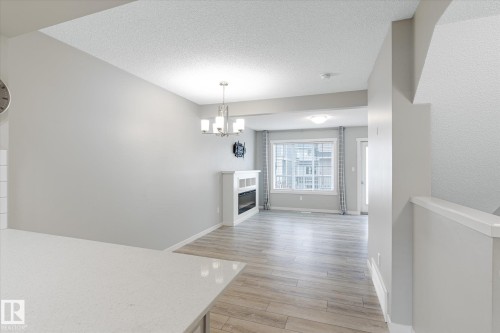 14 1110 Daniels Link Link, Edmonton, AB - Indoor With Fireplace