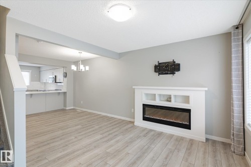 14 1110 Daniels Link Link, Edmonton, AB - Indoor Photo Showing Living Room With Fireplace