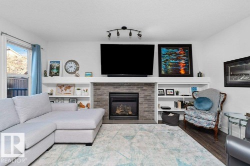 8220 Shaske Place, Edmonton, AB - Indoor Photo Showing Living Room With Fireplace
