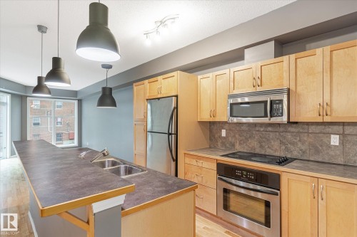 511 10503 98 Avenue, Edmonton, AB - Indoor Photo Showing Kitchen With Stainless Steel Kitchen With Double Sink