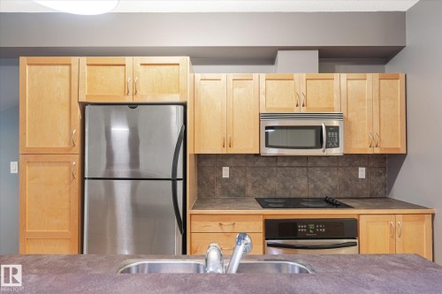 511 10503 98 Avenue, Edmonton, AB - Indoor Photo Showing Kitchen With Stainless Steel Kitchen With Double Sink