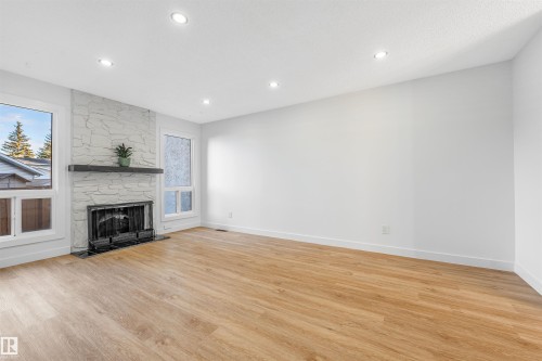 6030 Mill Woods Rd S, Edmonton, AB - Indoor Photo Showing Living Room With Fireplace