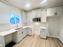 90 Dansereau Way, Beaumont, AB  - Indoor Photo Showing Kitchen With Double Sink 