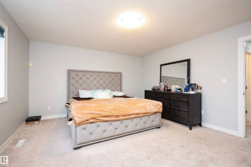 Bedroom featuring carpet floors - 2060 Ware Road, Edmonton, AB - Indoor Photo Showing Bedroom