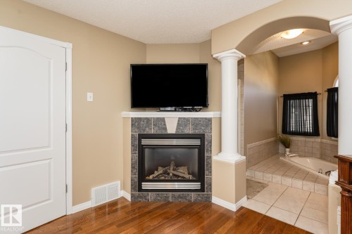 12927 Hudson Way, Edmonton, AB - Indoor Photo Showing Other Room With Fireplace
